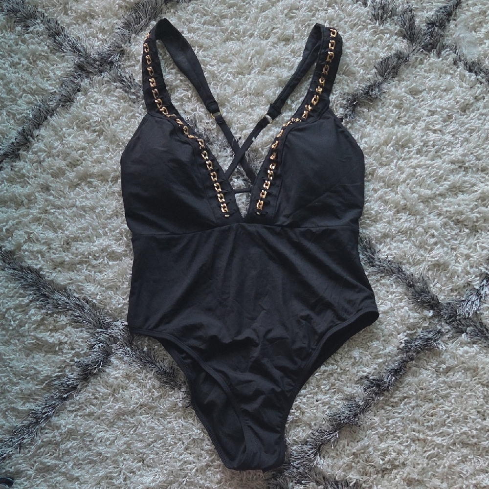 Kenneth Cole Black Swimwear with Gold Details